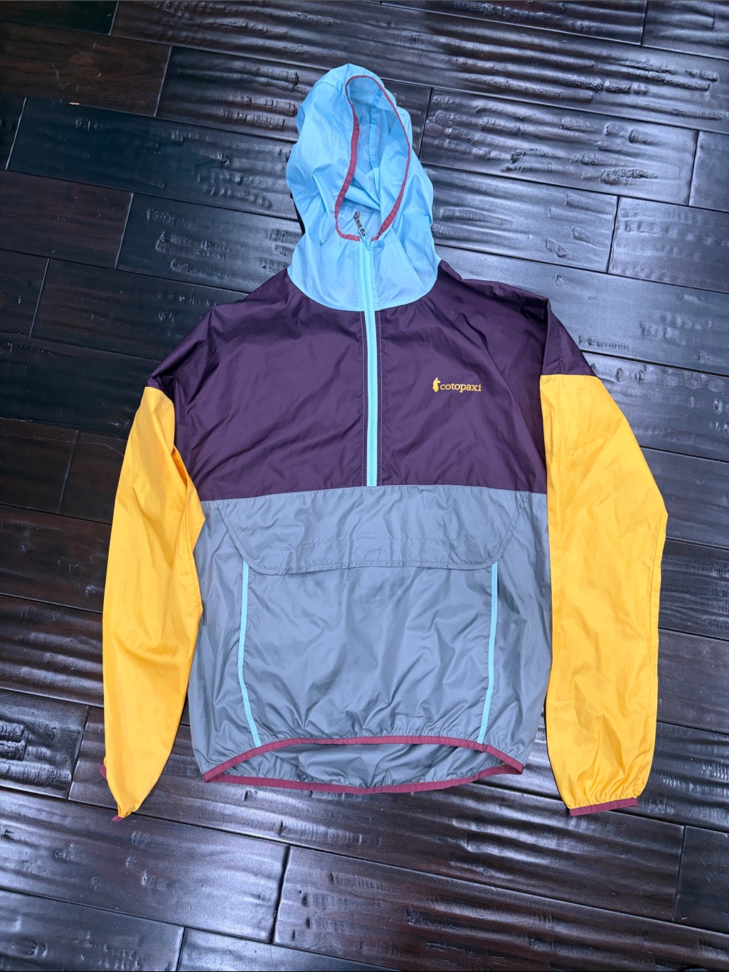 Cotopaxi Colorblock Packable Jacket - Purple, Gray, Yellow & Light Blue.